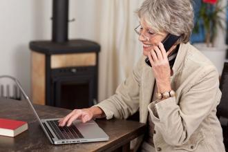 Generic Female pensioner using laptop Generic Female pensioner using laptop
