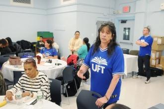 UFT Staten Island Parent and Community Outreach Liaison Marie Rodriguez checks in on some of the parents at the Staten Island UFT Family Partnership Summit on Nov. 9, 2024. 