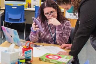 Educators at the Longwood Academy of Discovery meet in the new Teacher Center. Educators at the Longwood Academy of Discovery meet in the new Teacher Center.