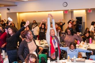 Clinicians take a stretch break between speakers at the 2025 Clinician Appreciation Day held at UFT headquarters on Jan. 27, 2025. 