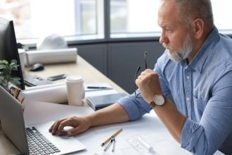 Generic man working on a laptop