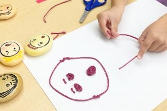 Inside my classroom A student wearing a mask participates in art class