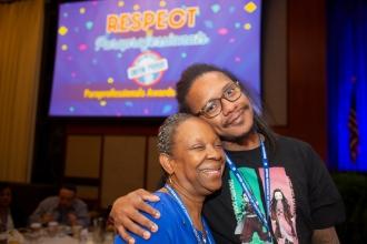 A man greets his former paraprofessional at the UFT Paraprofessional Awards Luncheon on March 22, 2025. 
