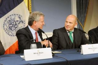 Two men shaking hands at table